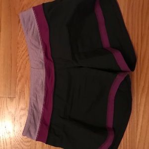 Lululemon Dark Gray Short with Purple Detailing.